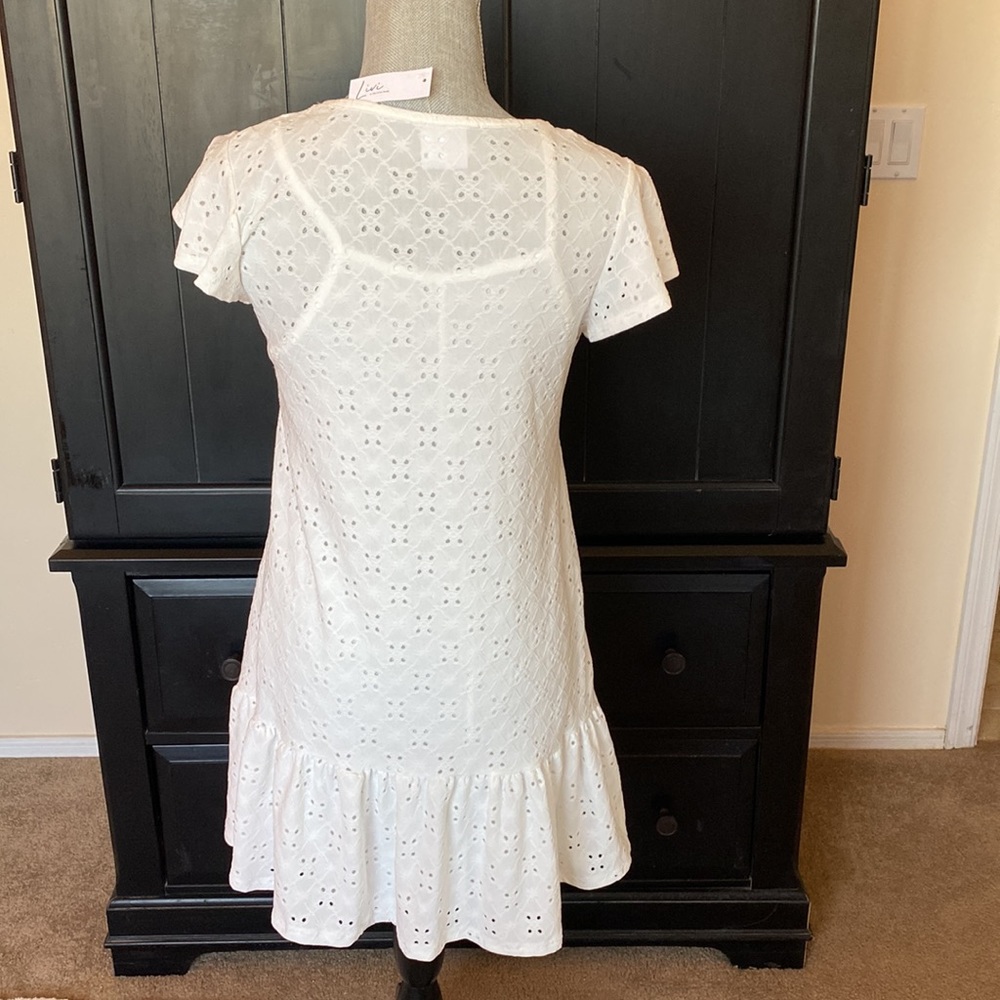 NEW W/ TAGS. Cute eyelet dress/attached liner. Flutter sleeves/ruffle hem. Med - Picture 2 of 6